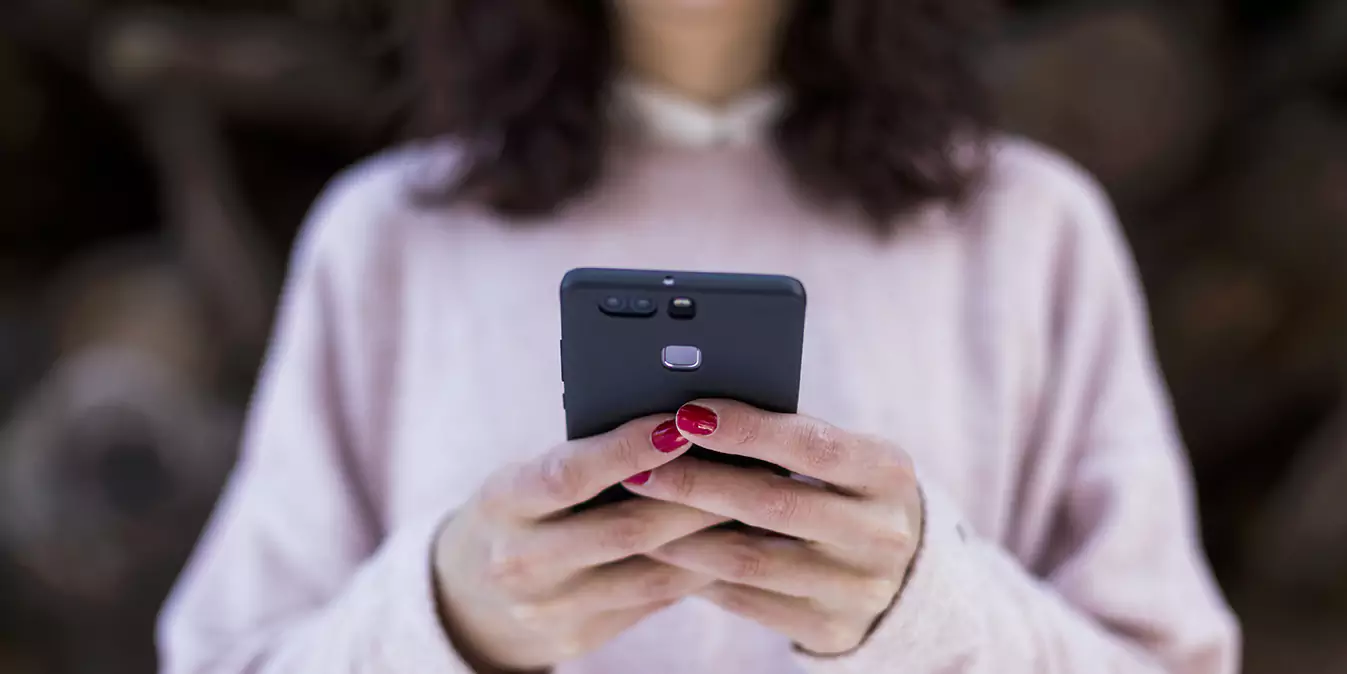 woman holding phone